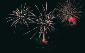 Vibrant fireworks illuminating the night sky with colorful bursts.